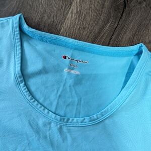 - - Champion XL women's Tee shirt. Polyester spandex blend. Criss Cross pattern.